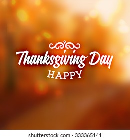Thanksgiving Day Holiday Typographic Design. Calligraphic Elements. Blurred Autumn Forest Background.