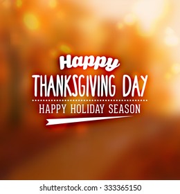 Thanksgiving Day Holiday Typographic Design. Calligraphic Elements. Blurred Autumn Forest Background.
