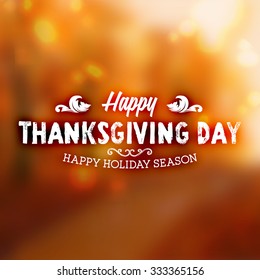 Thanksgiving Day Holiday Typographic Design. Calligraphic Elements. Blurred Autumn Forest Background.