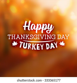 Thanksgiving Day Holiday Typographic Design. Calligraphic Elements. Blurred Autumn Forest Background.