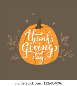 Thanksgiving Day lettering design on pumpkin illustration with leaves and hearts. Thanksgiving greeting card