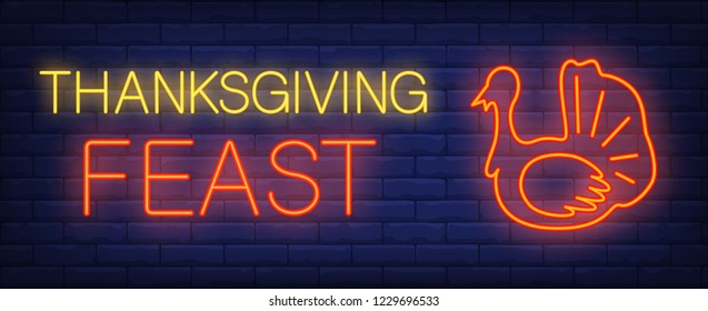 Thanksgiving feast neon text with turkey. Thanksgiving Day advertisement design. Night bright neon sign, colorful billboard, light banner. Vector illustration in neon style.