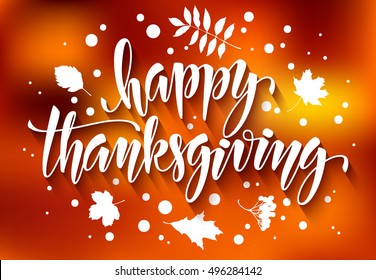Thanksgiving greeting card with hand drawn vector calligraphic inscription and leaves on blurred autumn background. Happy Thanksgiving
