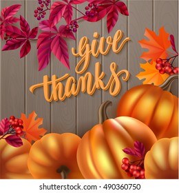 Thanksgiving greeting card. Handwritten brush calligraphy and autumn leaves, berries and pumpkins. Vector illustration for your design on wood background.