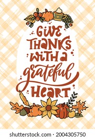 Thanksgiving lettering quote 'Give thanks with a grateful heart' decorated with hand drawn doodles on plaid background. Poster, print, card, invitation template. EPS 10