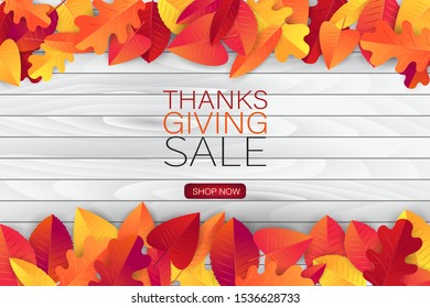 Thanksgiving sale poster.  Background with red and orange fall leaves on wooden board. American traditional november holiday. Banner for advertisement, promotion, invitation. Vector illustration.