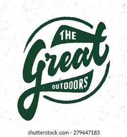 'The Great Outdoors' vintage retro t shirt apparel fashion graphic. Hand crafted hand lettered design. Typographic badge sign symbol. textured vector illustration.