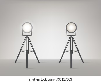 Theater, cinema, studio beaming spotlights on a tripod realistic vector illustration. Turned on and off cine lighting units, lightning equipment for performance or premiere stage illumination