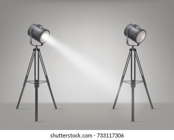 Theater, cinema, studio beaming spotlights on a tripod realistic vector illustration. Turned on and off cine lighting units, lightning equipment for performance or premiere stage illumination