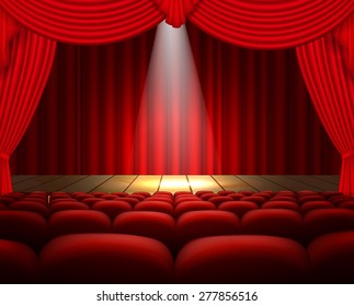 A theater stage with a red curtain, seats and a spotlight