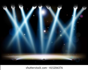 A theatre or theater stage and with footlights and spotlights