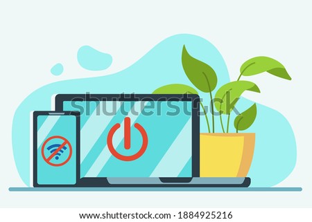 There is a laptop and a telephone on the table. On the screen gadgets symbol 