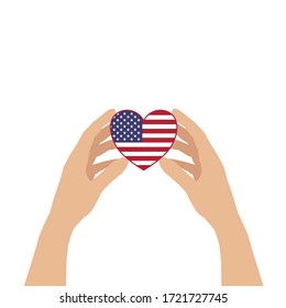 There are two hands holding a heart carefully isolated on white background. The heart is contained USA flag inside. Concept about love, care 