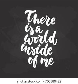 There is a world inside of me - travel and adventure hand drawn lettering quote in white color on the black chalkboard background. Fun ink calligraphy inscription