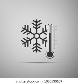 Thermometer with snowflake icon isolated on grey background. Flat design. Vector Illustration