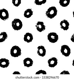 Thick hand drawn circles or rings. Seamless pattern in black and white. Perfect for wrapping paper, textile, fabric and backdrops. Set of coal thick circles. Vector polka dot pattern.