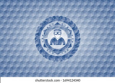 icono del ladrón dentro del emblema del hexágono azul.