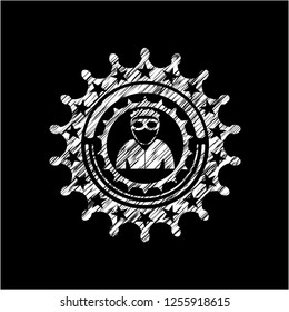 thief icon inside chalk emblem written on a blackboard