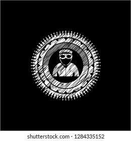 thief icon inside chalk emblem written on a blackboard
