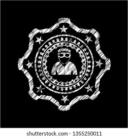 thief icon inside chalk emblem written on a blackboard