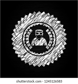 thief icon inside chalkboard emblem on black board