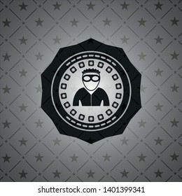 thief icon inside dark badge or emblem