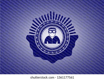 thief icon inside emblem with denim texture