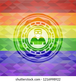 thief icon inside emblem on mosaic background with the colors of the LGBT flag
