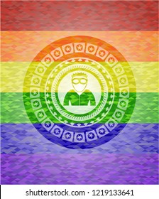 thief icon inside emblem on mosaic background with the colors of the LGBT flag