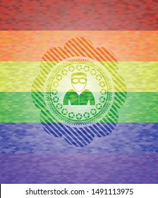 thief icon inside emblem on mosaic background with the colors of the LGBT flag