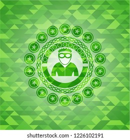 thief icon inside green mosaic emblem