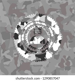 thief icon inside grey camouflaged emblem