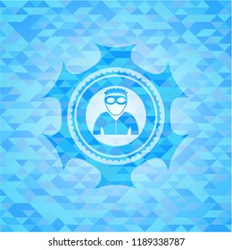 thief icon inside light blue mosaic emblem