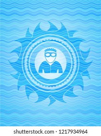 thief icon inside light blue water wave emblem.
