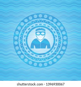thief icon inside sky blue water wave emblem.