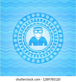 thief icon inside water wave style emblem.