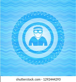 thief icon inside water wave representation emblem.