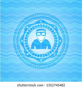 thief icon inside water wave style emblem.