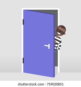 A thief trying to penetrate the house illegaly. Vector character wearing a black mask peeping out from behind the door. Flat illustration, clip art 