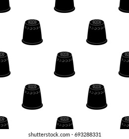 A thimble to protect your fingers when sewing.Sewing or tailoring tools kit single icon in black style vector symbol stock illustration.