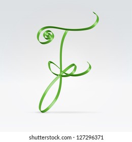 Thin green satin ribbon typeface capital F letter hanging over light background