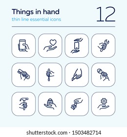 Things in hand line icon set. Holding smartphone, heart, gear, key. Holding hand concept. Can be used for topics like repair, housekeeping, communication