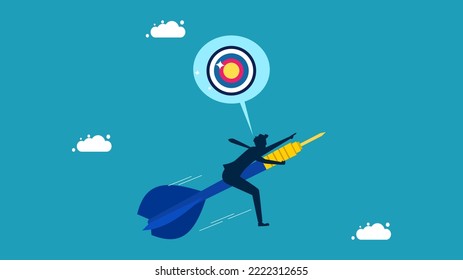 Think about goals. Businessman flying darts towards the target