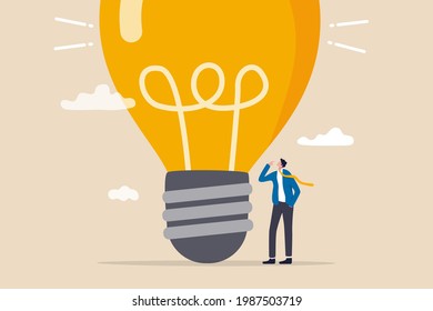 Think big, aspiration to win and success in business, big idea from creativity and imagination to overcome fear concept, smart businessman entrepreneur thinking with big oversized idea lightbulb.