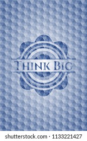 Think Big blue badge with geometric background.