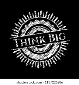 Think Big chalk emblem written on a blackboard