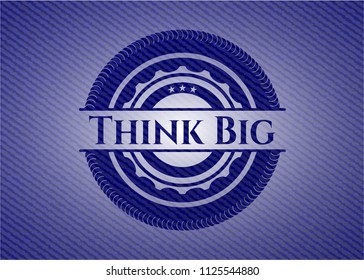 Think Big emblem with jean background