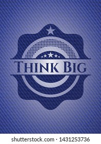 Think Big emblem with jean background. Vector Illustration. Detailed.