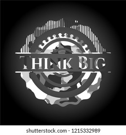 Think Big written on a grey camouflage texture