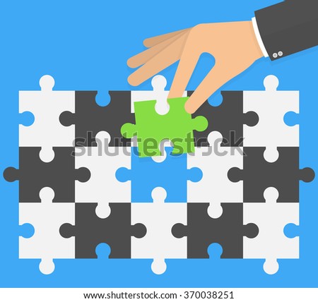 Think different concept. Hand putting or replacing green puzzle piece in a black and white pattern. Flat design
